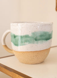 Thumbnail for Handmade speckled stoneware mug with a sea green glaze band and raw clay base, by Love Co Ceramics